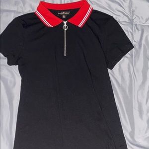 Black shirt with red and blue detailing.